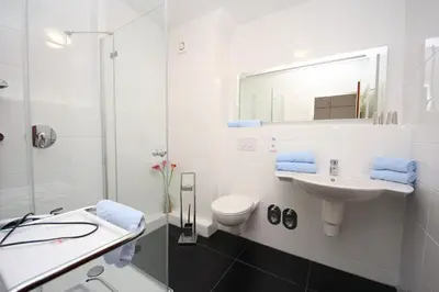Ein Badezimmer in der Unterkunft Kaiserallee, Fewo 115