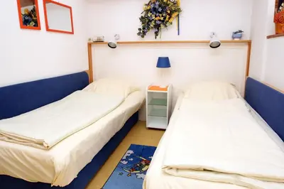 Ein Bett oder Betten in einem Zimmer der Unterkunft Kaiserallee, Fewo 120