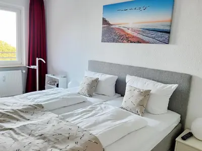 Ein Bett oder Betten in einem Zimmer der Unterkunft Kaiserallee, Fewo 117