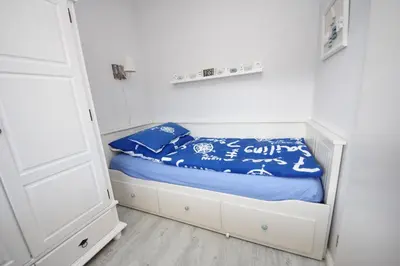 Ein Bett oder Betten in einem Zimmer der Unterkunft Strandredder, Fewo 103