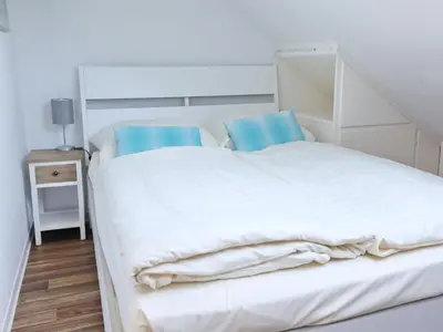 Ein Bett oder Betten in einem Zimmer der Unterkunft Rose, Fewo 178