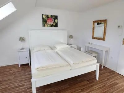 Ein Bett oder Betten in einem Zimmer der Unterkunft Rose, Fewo 178