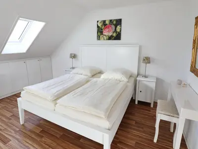 Ein Bett oder Betten in einem Zimmer der Unterkunft Rose, Fewo 178