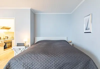 Ein Bett oder Betten in einem Zimmer der Unterkunft Kaiserallee, Fewo 217