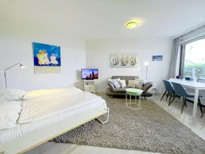 Ein Bett oder Betten in einem Zimmer der Unterkunft Kaiserallee, Fewo 177