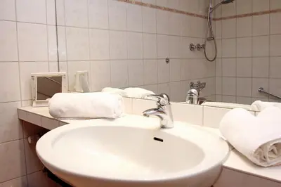 Ein Badezimmer in der Unterkunft Trelleborgallee, Fewo 113