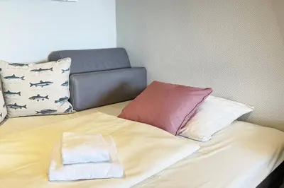Ein Bett oder Betten in einem Zimmer der Unterkunft Trelleborgallee Fewo 104