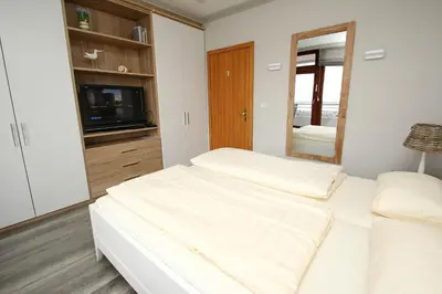 Ein Bett oder Betten in einem Zimmer der Unterkunft Trelleborgallee, Fewo 106