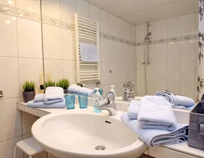 Ein Badezimmer in der Unterkunft Trelleborgallee, Fewo 106