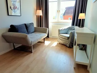 Ein Sitzbereich in der Unterkunft Strandredder, Fewo 163