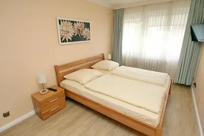 Ein Bett oder Betten in einem Zimmer der Unterkunft Strandredder, Fewo 163