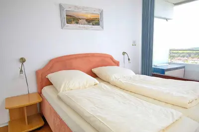 Ein Bett oder Betten in einem Zimmer der Unterkunft Trelleborgallee, Fewo 143