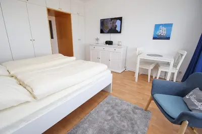 Ein Bett oder Betten in einem Zimmer der Unterkunft Trelleborgallee, Fewo 133