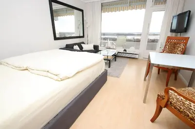 Ein Bett oder Betten in einem Zimmer der Unterkunft Trelleborgallee, Fewo 127