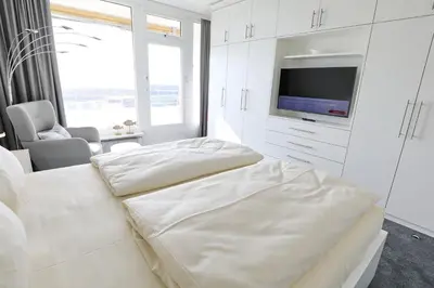 Ein Bett oder Betten in einem Zimmer der Unterkunft Trelleborgallee, Fewo 123