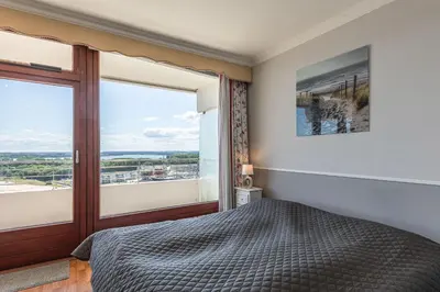 Ein Bett oder Betten in einem Zimmer der Unterkunft Trelleborgallee, Fewo 184