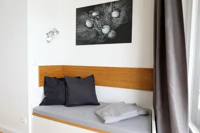 Ein Bett oder Betten in einem Zimmer der Unterkunft Trelleborgallee, Fewo 180