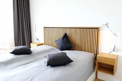 Ein Bett oder Betten in einem Zimmer der Unterkunft Trelleborgallee, Fewo 180