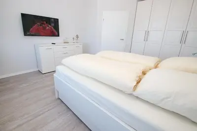 Ein Bett oder Betten in einem Zimmer der Unterkunft Trelleborgallee, Fewo 156