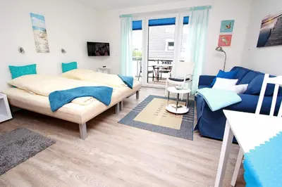Ein Bett oder Betten in einem Zimmer der Unterkunft Vogteistraße, Fewo 214