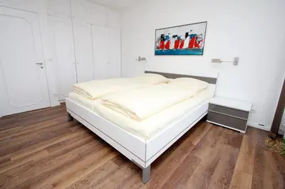 Ein Bett oder Betten in einem Zimmer der Unterkunft Trelleborgallee, Fewo 209