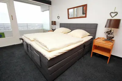 Ein Bett oder Betten in einem Zimmer der Unterkunft Trelleborgallee, Fewo 208
