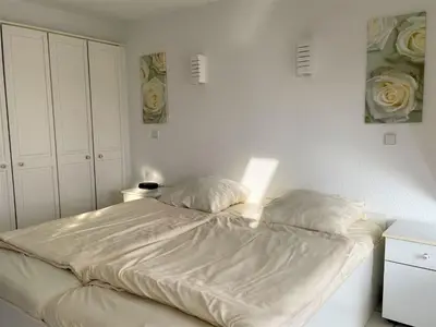 Ein Bett oder Betten in einem Zimmer der Unterkunft Vorderreihe, Fewo 210