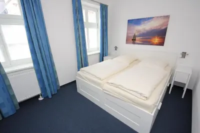 Ein Bett oder Betten in einem Zimmer der Unterkunft Vorderreihe, Fewo 108