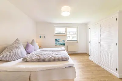 Ein Bett oder Betten in einem Zimmer der Unterkunft Ferienhaus Haff Huus 2 Haffkrug