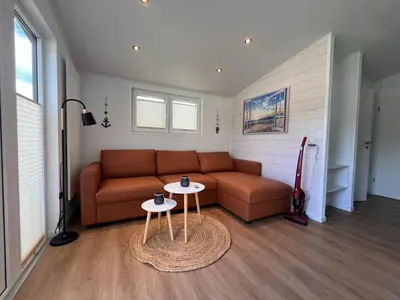 Ein Sitzbereich in der Unterkunft Ostseecamp Ferienhaus Küstenklang