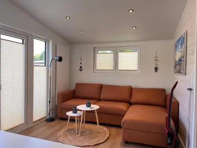 Ein Sitzbereich in der Unterkunft Ostseecamp Ferienhaus Küstenklang
