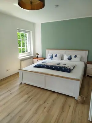 Ein Bett oder Betten in einem Zimmer der Unterkunft Villa Scharbeutz, Pönitz