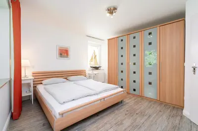 Ein Bett oder Betten in einem Zimmer der Unterkunft Ferienwohnung 