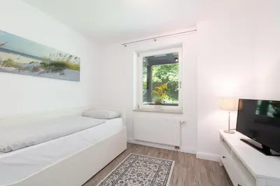 Ein Bett oder Betten in einem Zimmer der Unterkunft Ferienwohnung 