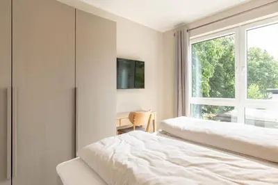 Ein Bett oder Betten in einem Zimmer der Unterkunft Ferienwohnung Villa Heidenreich Nr.4 - Scharbeutz