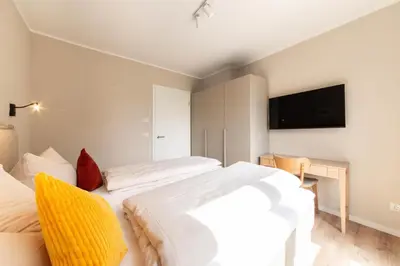 Ein Bett oder Betten in einem Zimmer der Unterkunft Ferienwohnung Villa Heidenreich Nr.4 - Scharbeutz