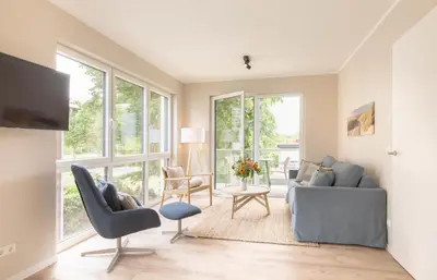 Ein Sitzbereich in der Unterkunft Ferienwohnung Villa Heidenreich Nr.4 - Scharbeutz