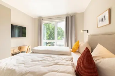 Ein Bett oder Betten in einem Zimmer der Unterkunft Ferienwohnung Villa Heidenreich Nr.4 - Scharbeutz