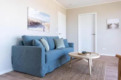 Ein Sitzbereich in der Unterkunft Ferienwohnung Villa Heidenreich Nr.3 - Scharbeutz