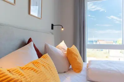 Ein Bett oder Betten in einem Zimmer der Unterkunft Ferienwohnung Villa Heidenreich Nr.3 - Scharbeutz