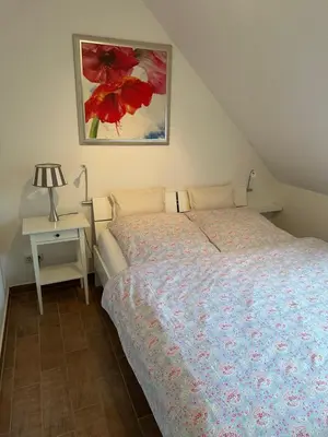 Ein Bett oder Betten in einem Zimmer der Unterkunft Eastside am Kurpark