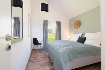 Ein Bett oder Betten in einem Zimmer der Unterkunft Strandpark Sierksdorf Smilla H67