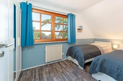 Ein Bett oder Betten in einem Zimmer der Unterkunft Ferienparadies Seeweg 2
