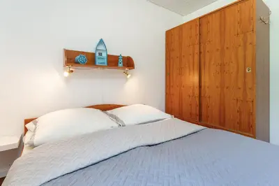 Ein Bett oder Betten in einem Zimmer der Unterkunft Ferienparadies Seeweg 6