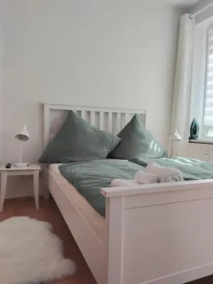 Ein Bett oder Betten in einem Zimmer der Unterkunft Ferienwohnung am Bahnhof Meierstr 43