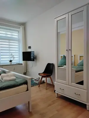Ein Bett oder Betten in einem Zimmer der Unterkunft Ferienwohnung am Bahnhof Meierstr 43