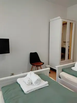 Ein Bett oder Betten in einem Zimmer der Unterkunft Ferienwohnung am Bahnhof Meierstr 43