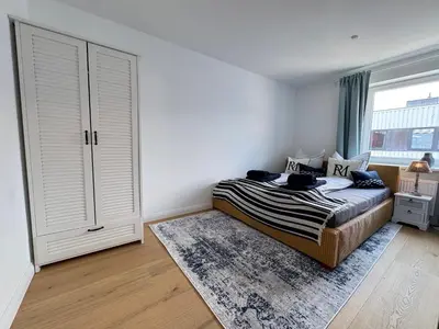 Ein Bett oder Betten in einem Zimmer der Unterkunft HarborEscape - Teil der HolidayEscapes Kollektion