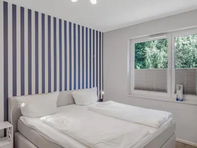 Ein Bett oder Betten in einem Zimmer der Unterkunft Objekt-Nr 65 - Priwall - Mecklenburger Landstraße