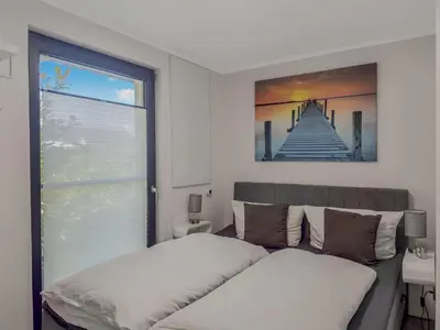 Ein Bett oder Betten in einem Zimmer der Unterkunft Objekt-Nr 236 - Priwall - Sanddornweg